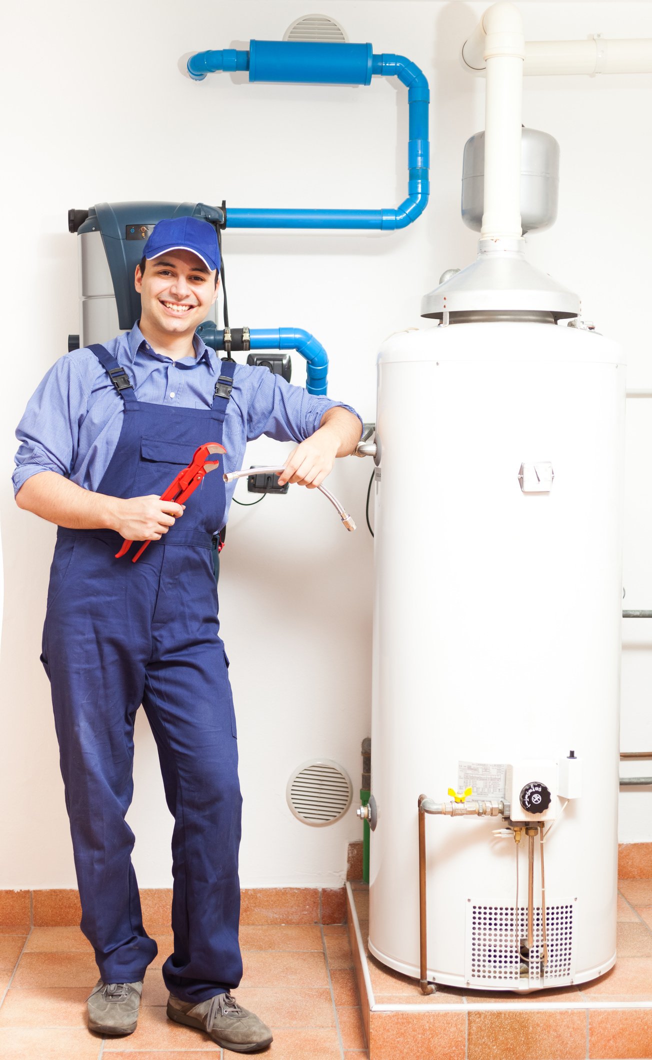 Smiling plumber at work